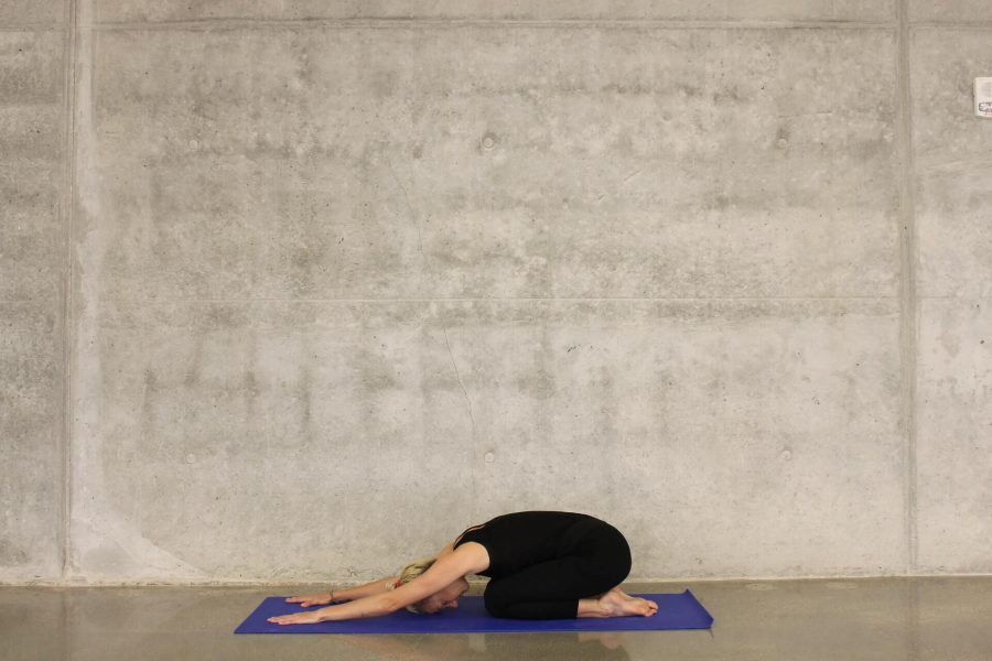 Woman performing Yoga Child Pose